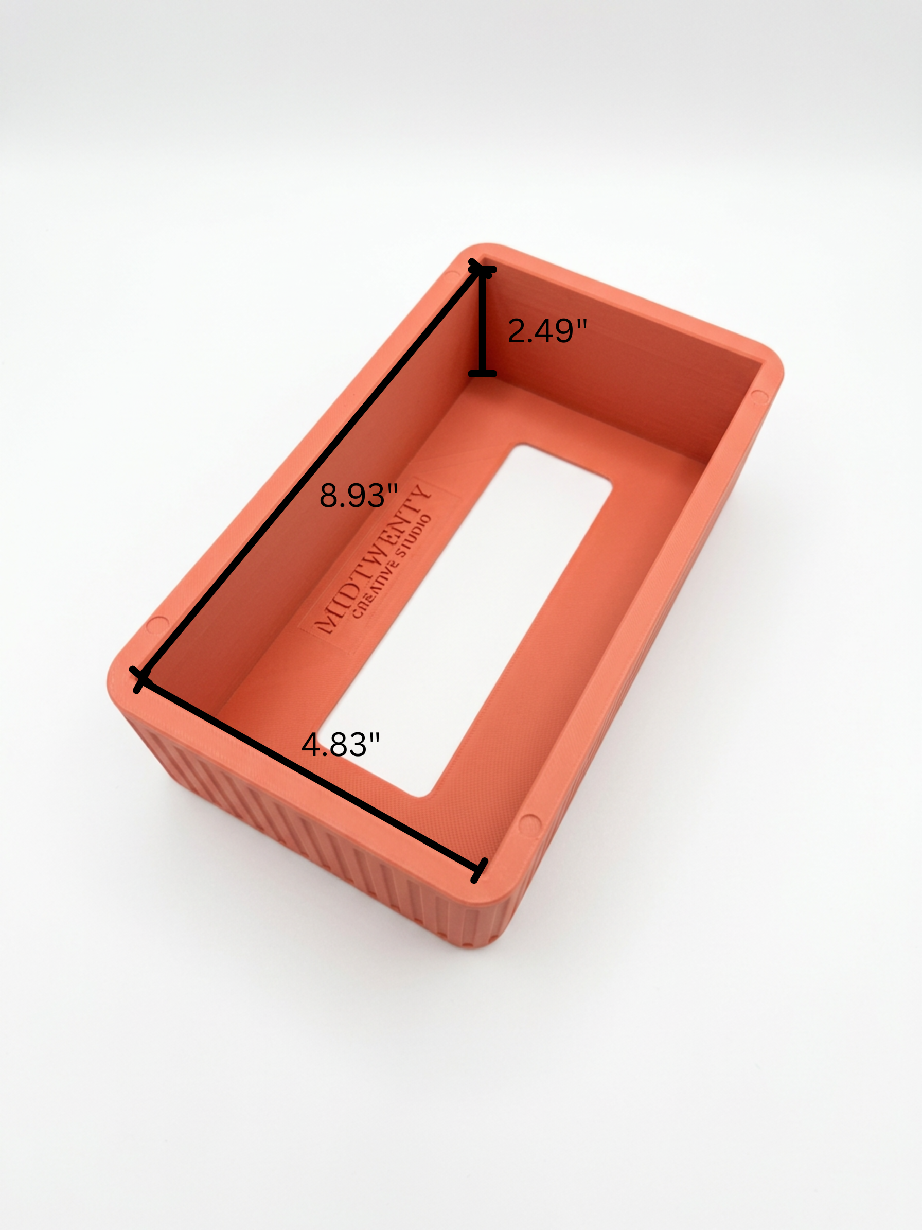 A orange rectangular tissue box cover with vertical fluted ridges, shown with measurements of 8.93in Length, 4.83in Width, 2.49in Height