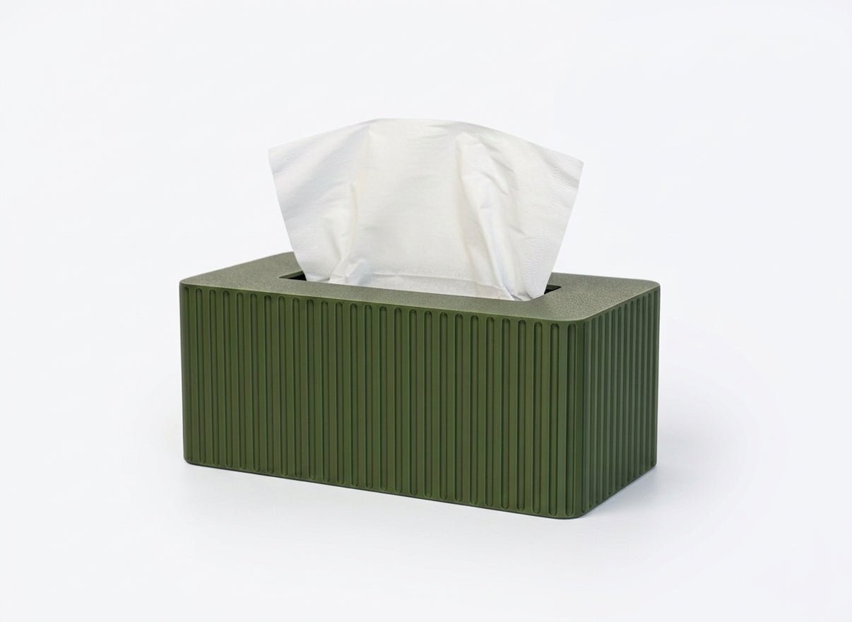 Green tissue box with fluted texture on a white background