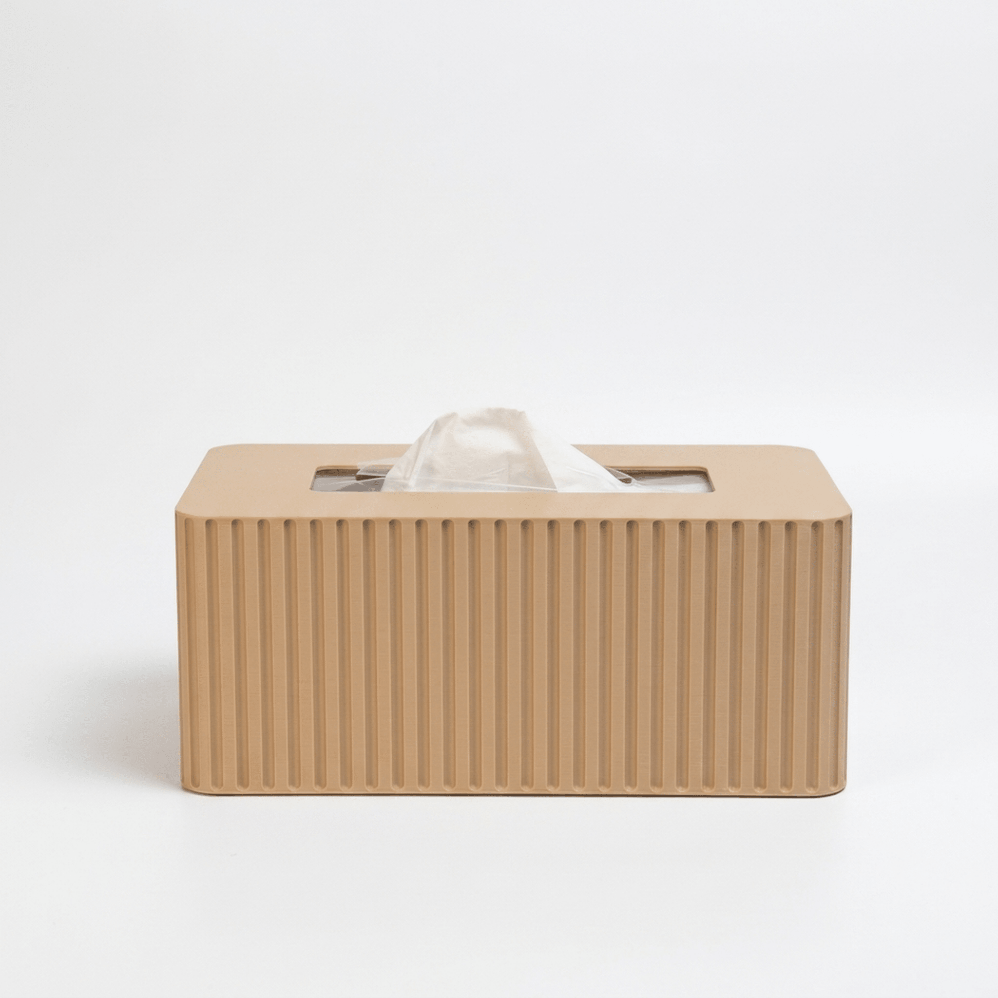 Beige tissue box with fluted texture on a white background