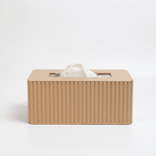 Beige tissue box with fluted texture on a white background