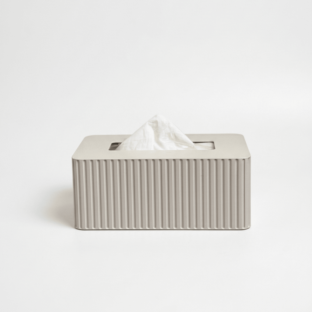 Off-white rectangular tissue box with fluted texture on a white background