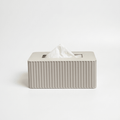 Off-white rectangular tissue box with fluted texture on a white background